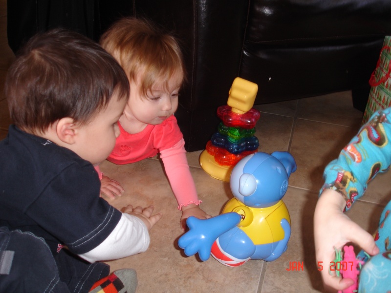 Kaylyn playing with the monkey Cassius gave her for Christmas